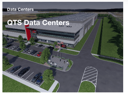 Aerial rendering of a proposed QTS data center campus: a long grey warehouse-style building with a red entrance, surrounded by parking lots and an access road cut through open farmland